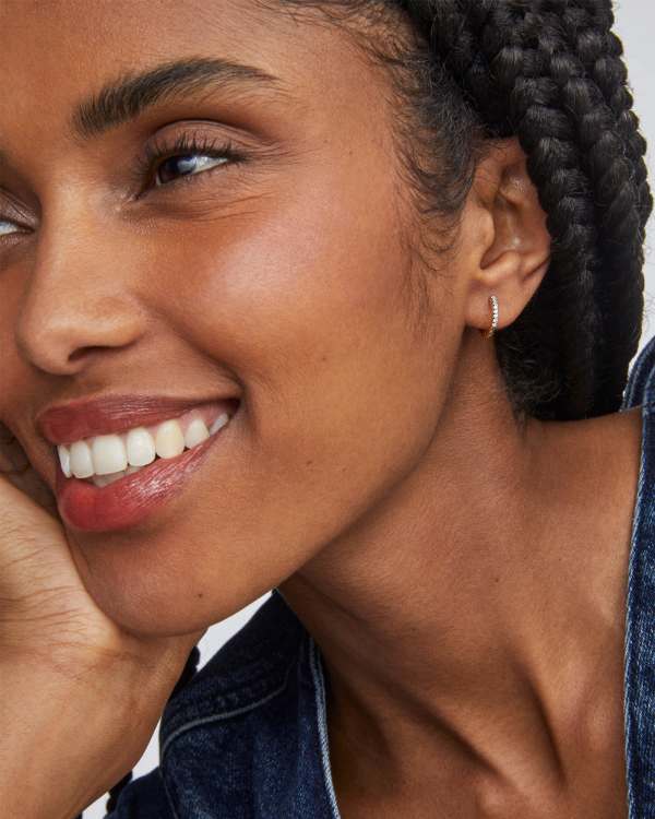 Mila 14k Yellow Gold Huggie Earrings in White Diamond - view 2